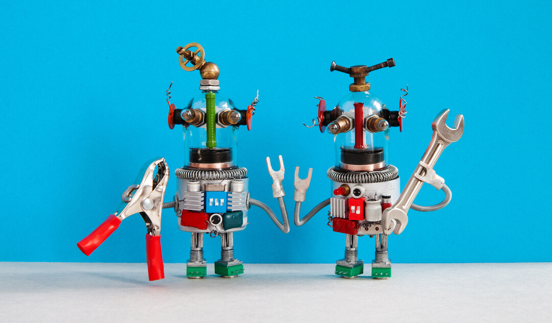 two-funny-repairman-robots-with-tools-in-their-han-UE3RKCM
