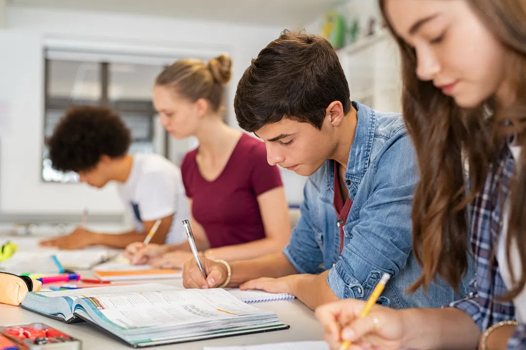 high-school-students-doing-exam-in-classroom-ES4GXBG copy