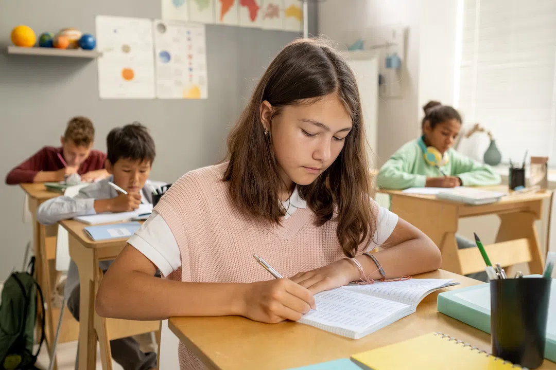 caucasian-elementary-schoolgirl-making-notes-at-le-2021-09-24-03-46-37-utc copy