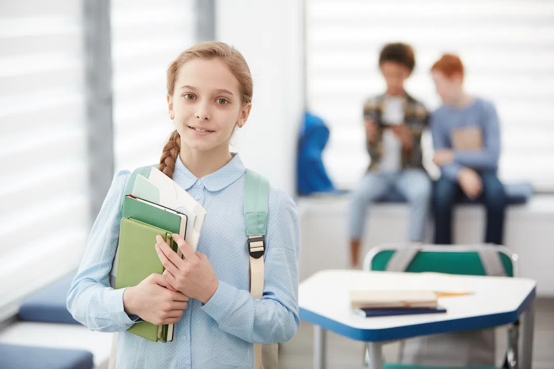 cute-girl-posing-in-school-classroom-2021-09-24-03-47-39-utc