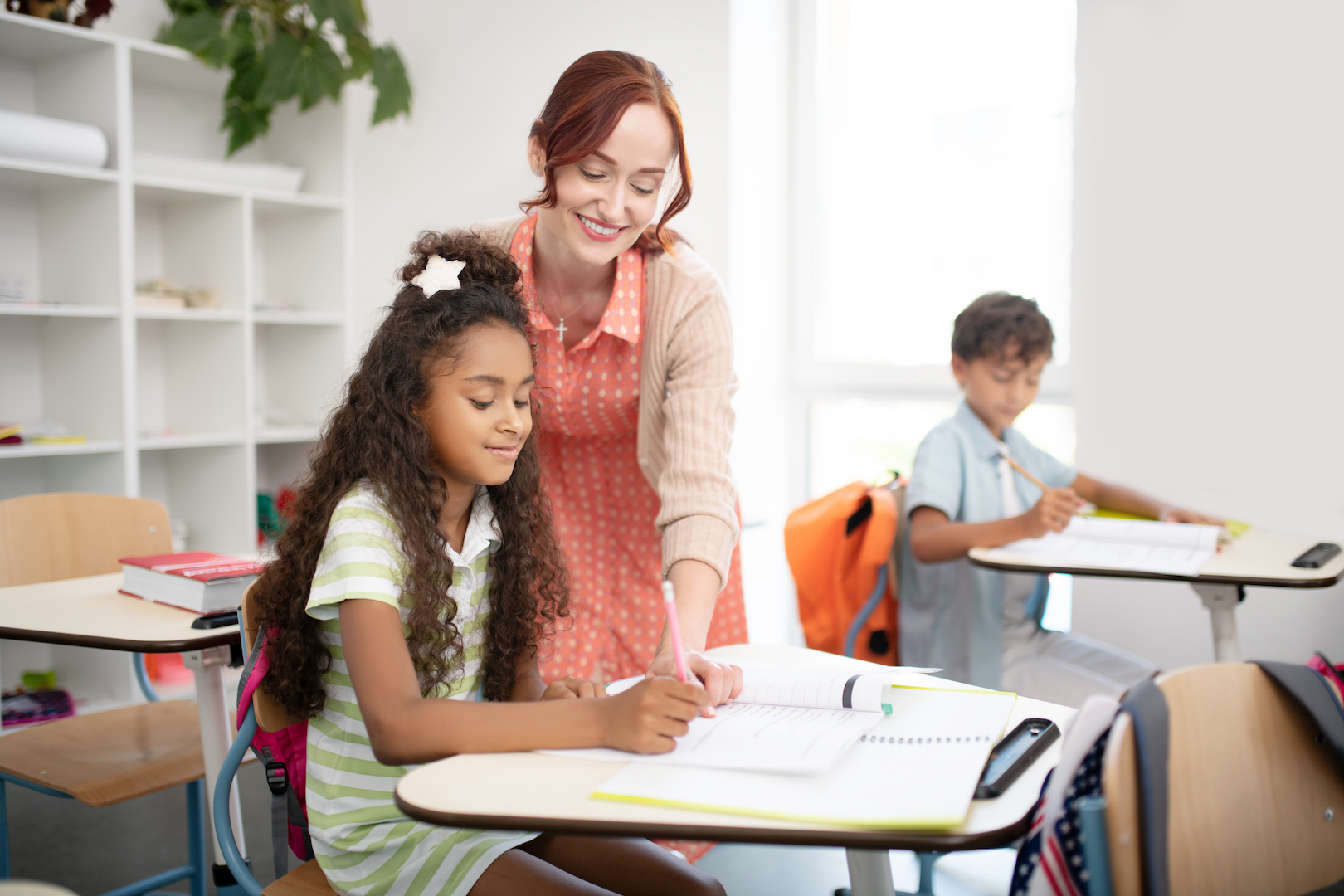 Beaming teacher feeling good while doing her favorite job