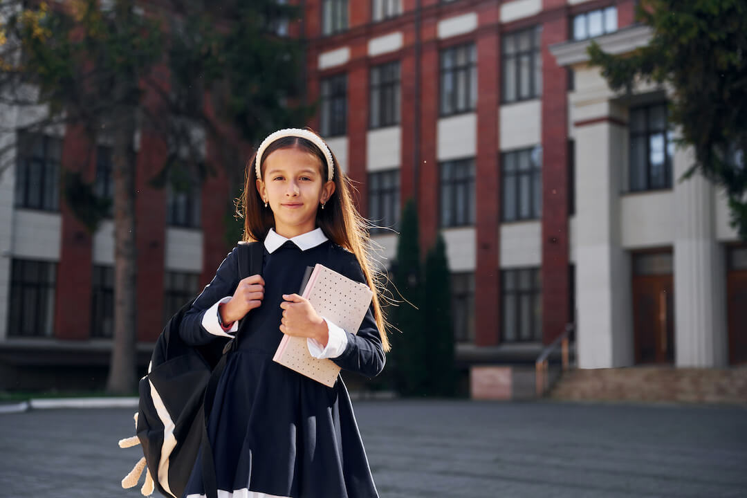 after-lessons-schoolgirl-is-outside-near-school-b-2021-12-27-16-12-33-utc-2