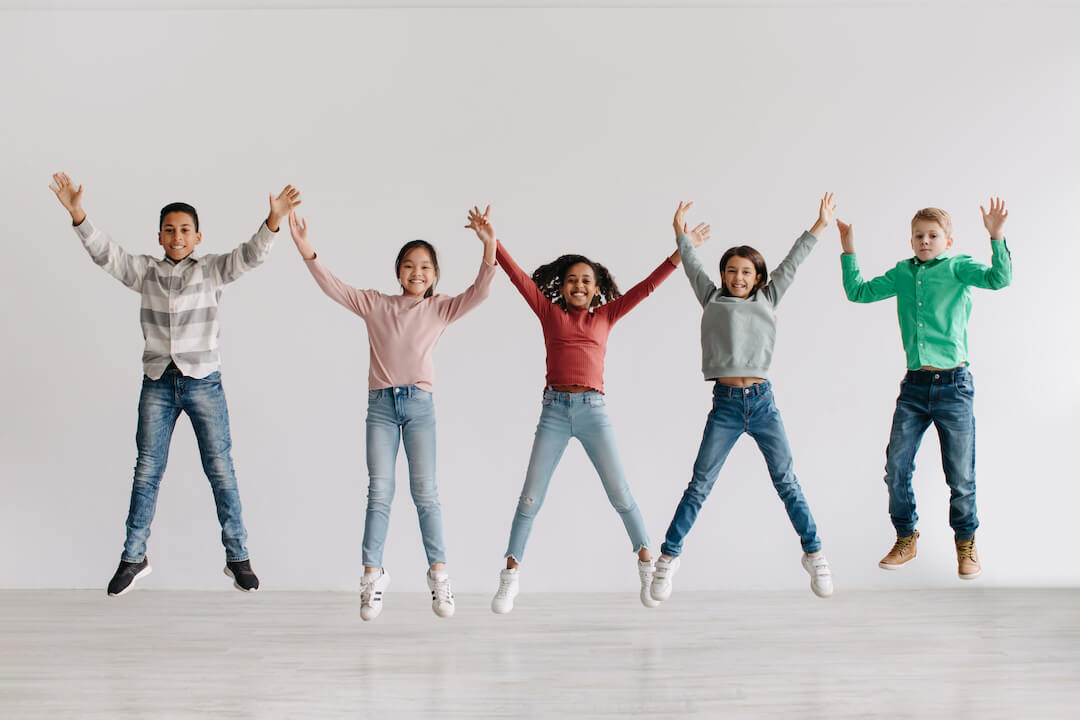 group-of-joyful-diverse-kids-jumping-raising-arms-2022-12-16-07-23-07-utc-2
