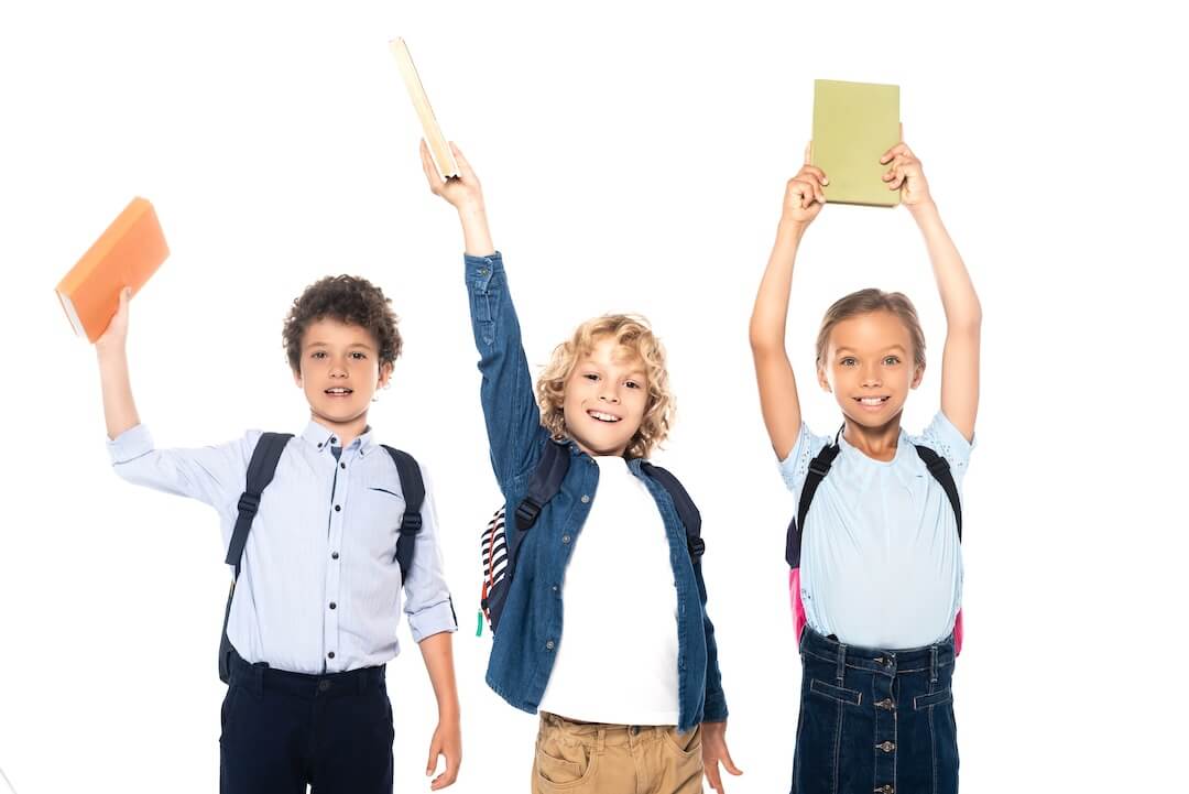 curly-schoolboys-and-schoolgirl-holding-books-abov-2023-11-27-05-00-25-utc-2-1
